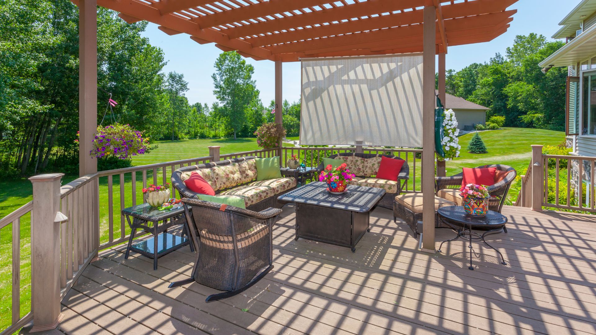 A patio with a couch, table and chairs