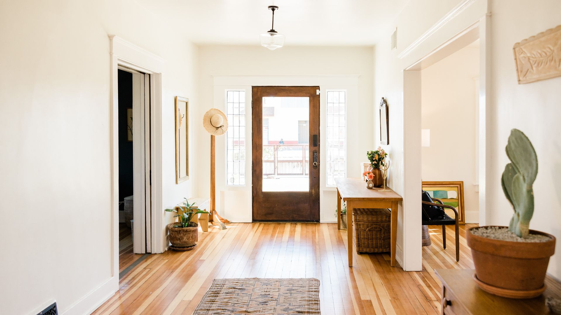 A hallway with a wooden floor and a door